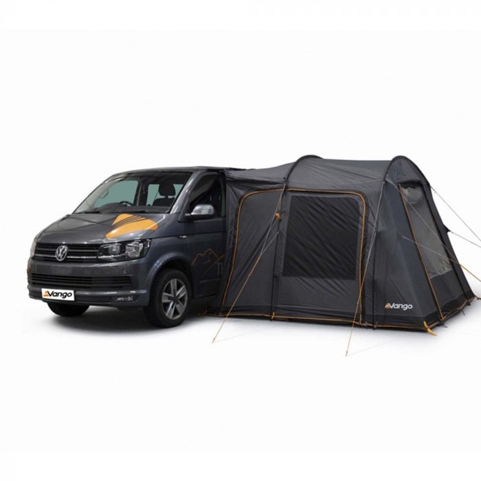 A VW camper van with a tent connected