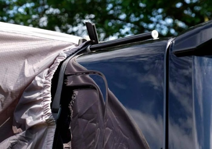 A pole and clamp awning set up